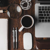 cup of coffee near MacBook Pro