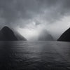 landscape photography of body of water under gray sky