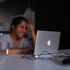 smiling woman using MacBook