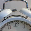 silver and white round analog clock