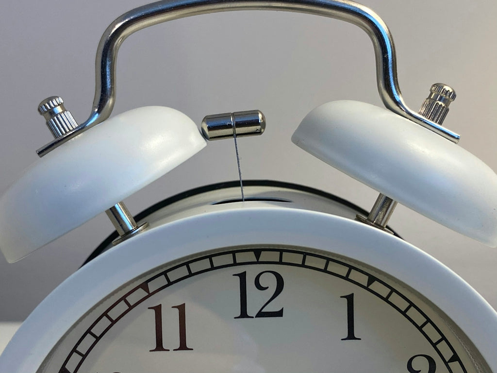 silver and white round analog clock