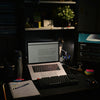 a laptop sits on a desk