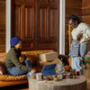 a group of people sitting around a living room
