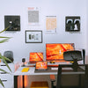 a desk with two monitors and a keyboard