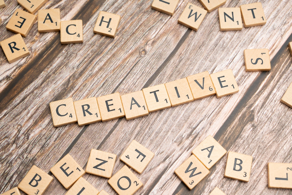 scrabble tiles spelling out the word creative