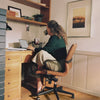 Woman working at desk with coffee